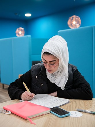 Student studying on her own in Nottingham quiet study area
