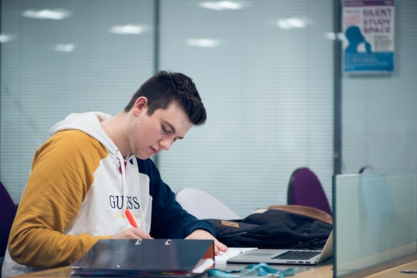 Male student studying Male student studying