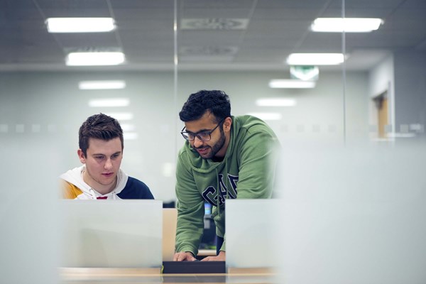 Two male students working together Two male students working together